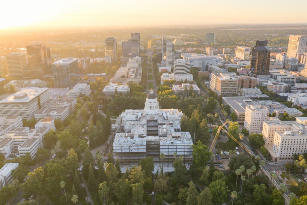 Sunlit city skyline aerial used for regional market perspective