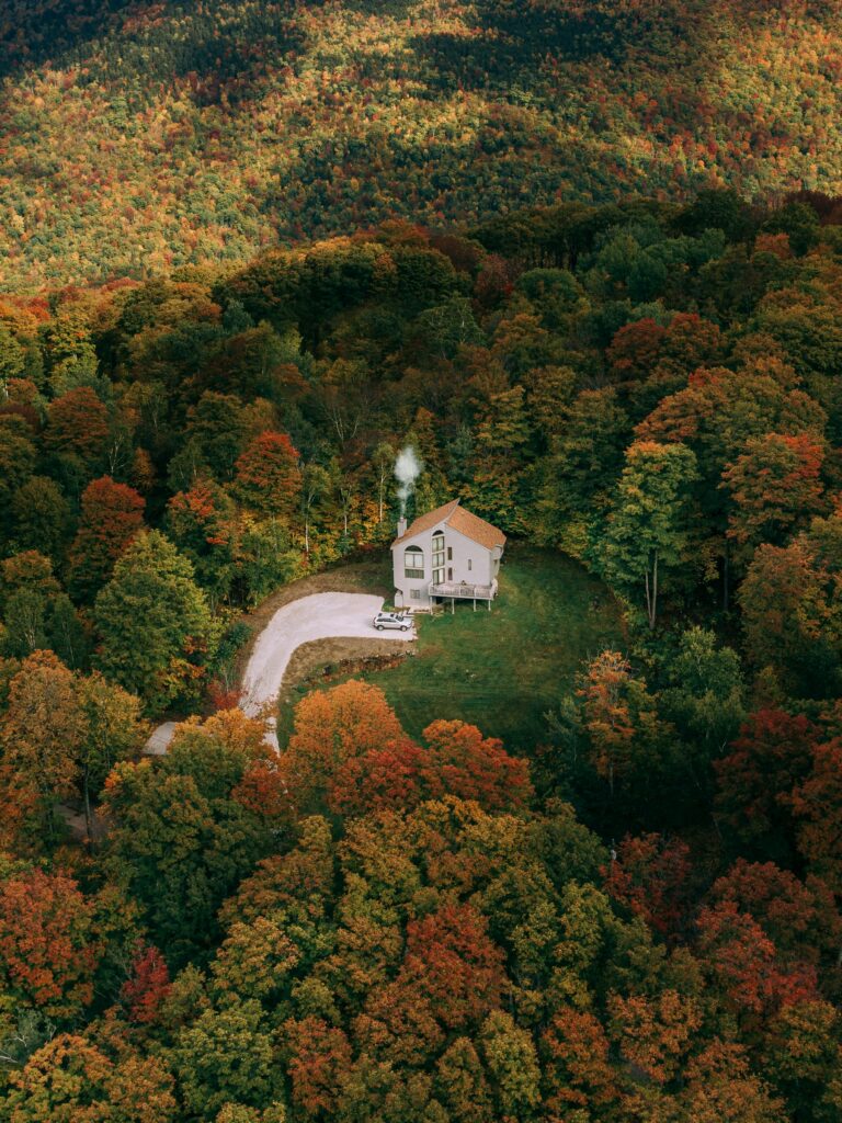 Private home surrounded by autumn trees for lifestyle and location storytelling